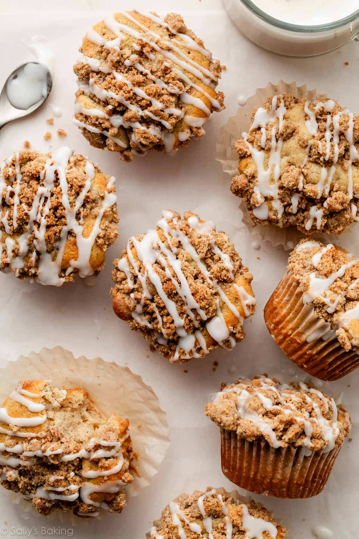 crumb cake muffins with icing on top.