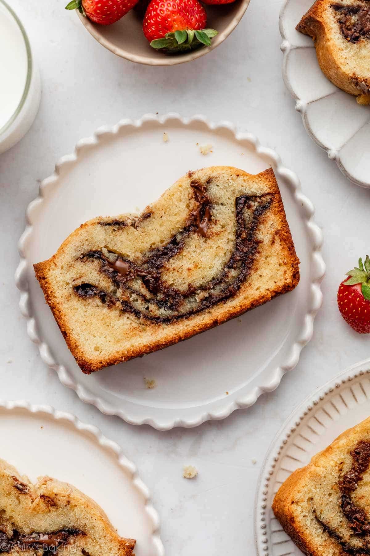 slice of Nutella swirl pound cake on white plate.